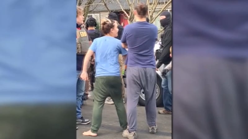 FILE - Neighbors confront federal ICE agents in Portland, Ore. in 2025.