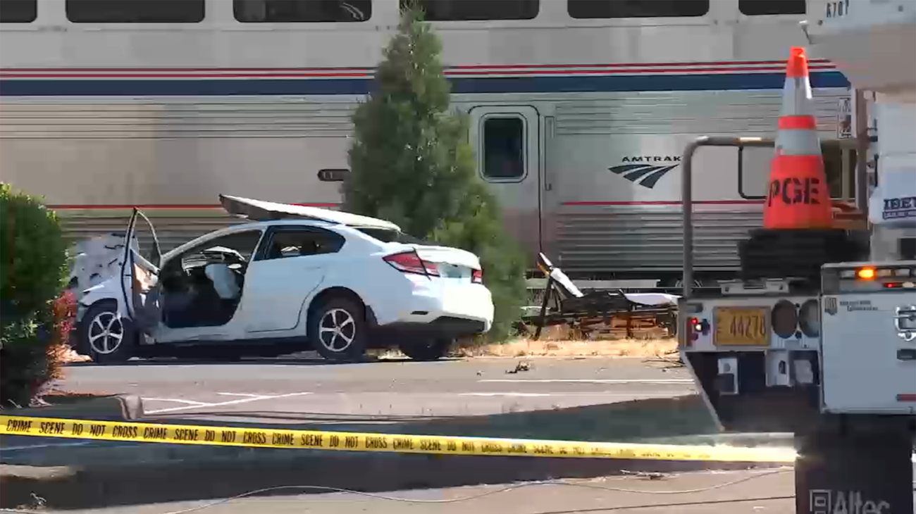 Woman dies after car hit by Amtrak train in Milwaukie