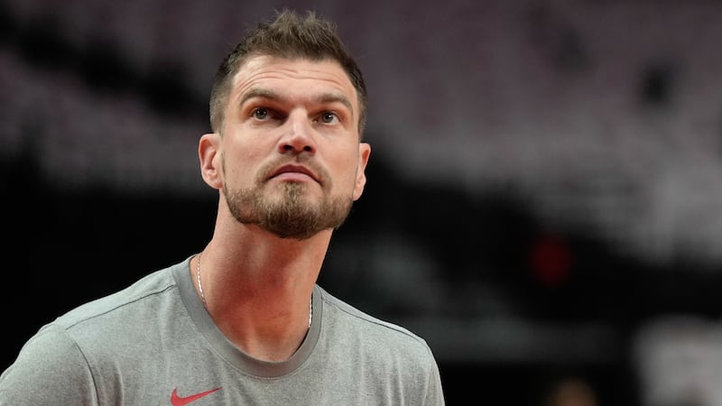 Portland Trail Blazers assistant coach Tiago Splitter helps warm up players before an NBA...