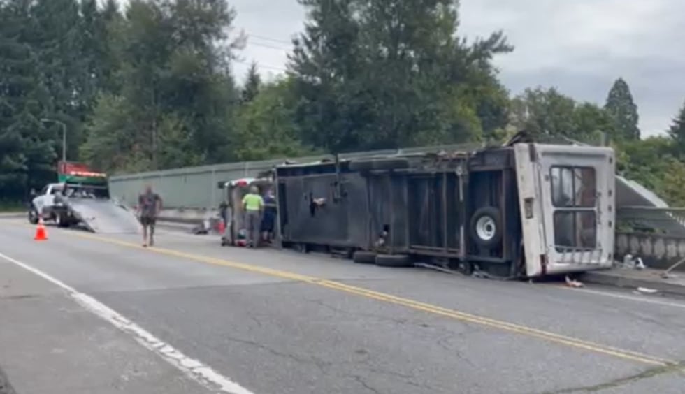 Police say a mechanical failure led to a crash that rolled a truck and attached travel trailer...