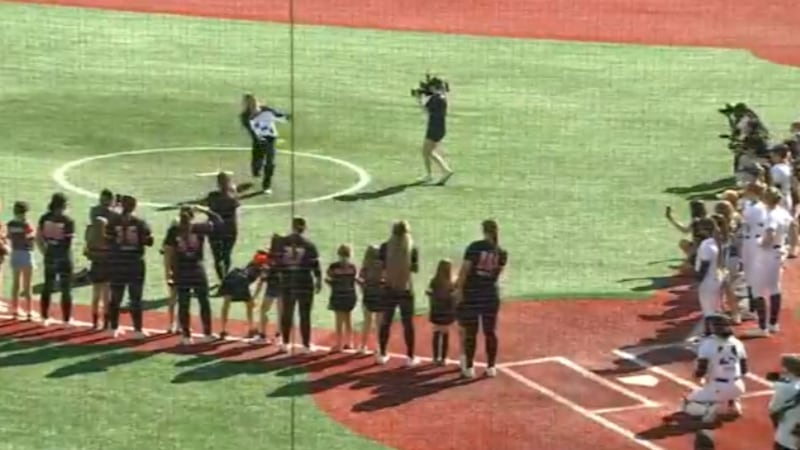 Portland Fire guard Sarah Ashlee Barker throws out the first pitch at a Portland Cascade game.