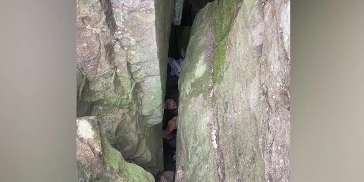 Woman stuck 7 hours upside-down between rocks after trying to retrieve ...