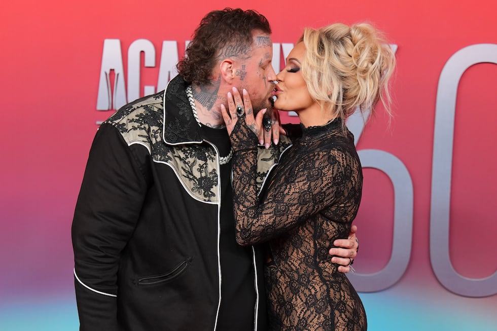 Jelly Roll, left, and Bunnie XO arrive at the 60th annual Academy of Country Music Awards on...