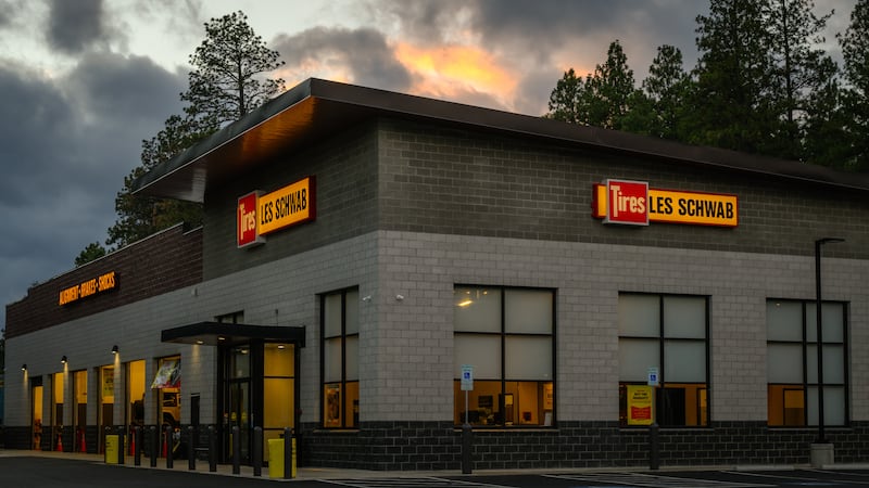 File - October 28, 2024; Evening light at Les Schwab tire business with illuminated signs