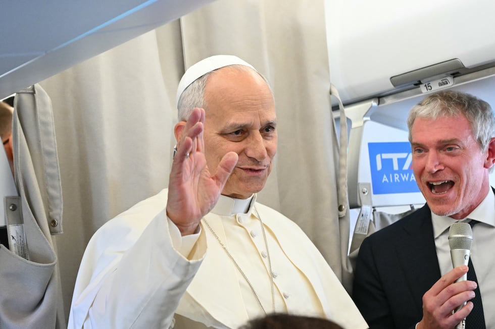 Pope Leo XIV talks to reporters aboard an aircraft on his way to Beirut, Lebanon, Sunday, Nov....