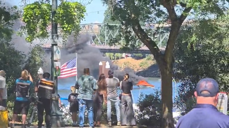 Five people were hurt when a boat caught fire on the Willamette River through downtown...