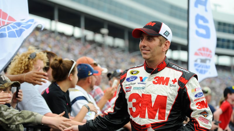 Greg Biffle greets fans before the NASCAR Sprint Cup Series auto race at Texas Motor Speedway...