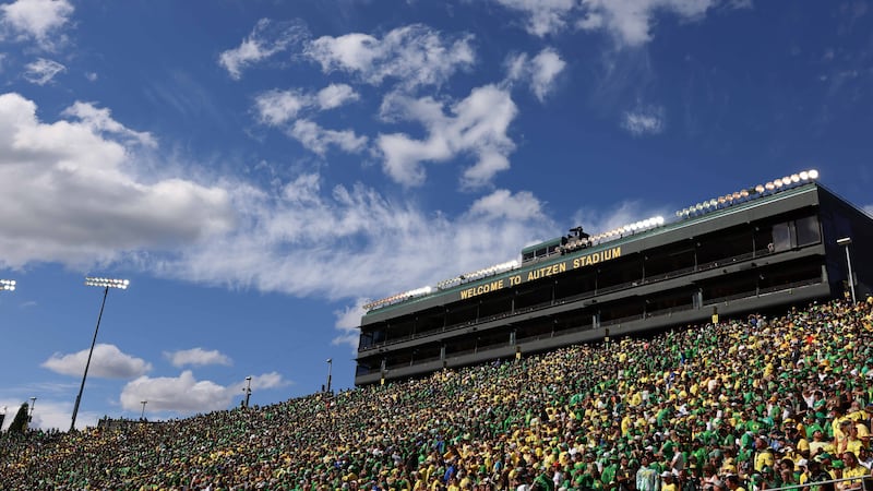 Fans look on during an NCAA college football game between Boise State and Oregon in Eugene,...
