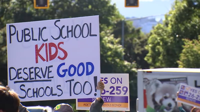 Students and parents rally outside of Cleveland High School