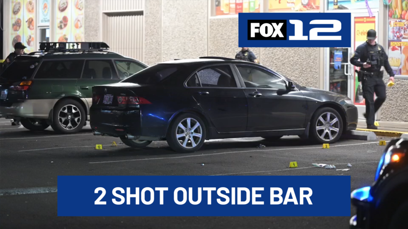 Two men were shot and injured in front of a southeast Portland bar early Saturday.